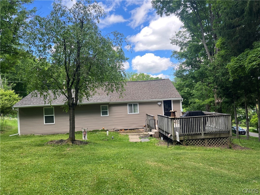 4982 Aitchison Road Onondaga, NY 13215 - Photo 23 of 26 View of the house and deck from the back yard