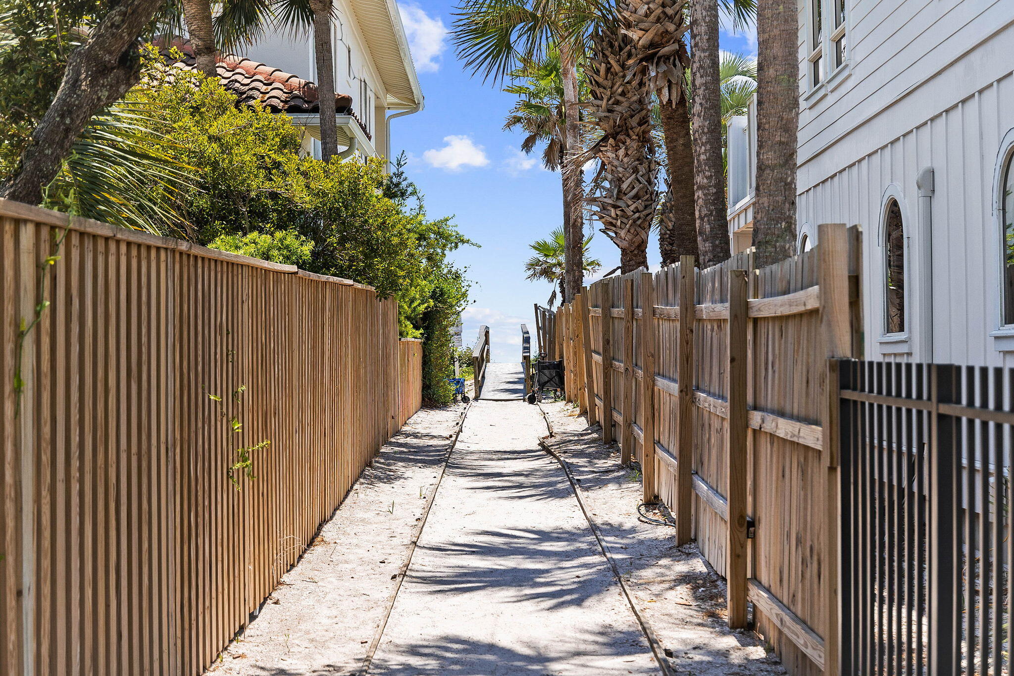 145 Spires Lane, Unit 205 Santa Rosa Beach, FL 32459 - Photo 35 of 40 a view of a pathway with a wrought fence