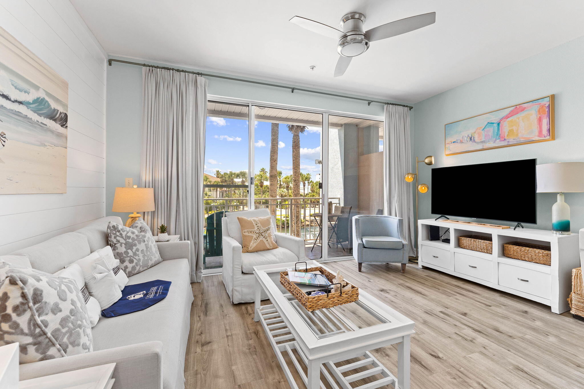 145 Spires Lane, Unit 205 Santa Rosa Beach, FL 32459 - Photo 5 of 40 a living room with furniture and a flat screen tv