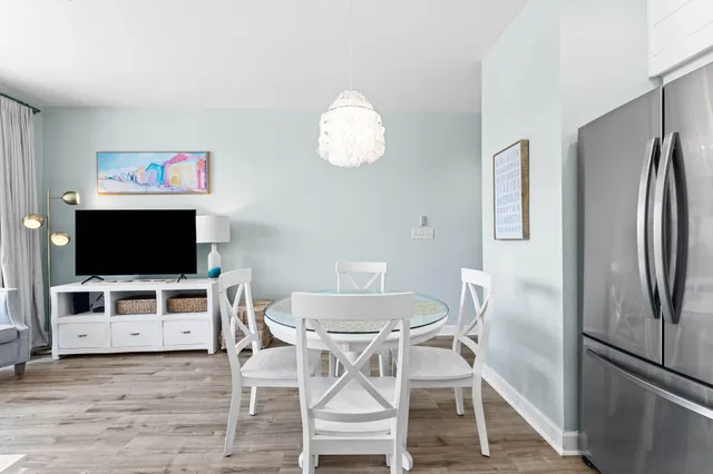 a view of a livingroom with furniture and a flat screen tv