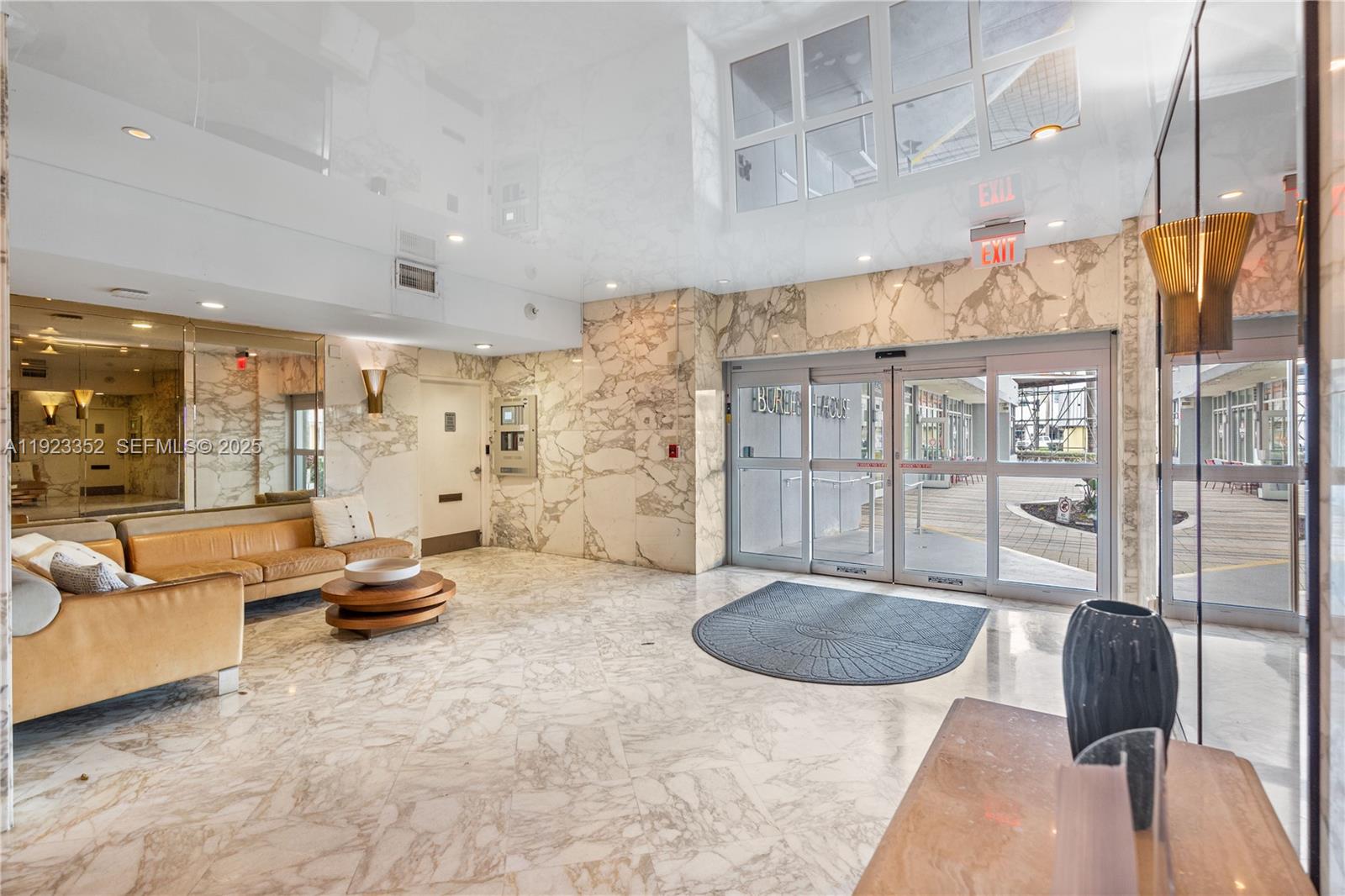 7135 Collins Avenue, Unit PH31 Miami Beach, FL 33141 - Photo 12 of 20 a view of a livingroom with furniture and floor to ceiling window