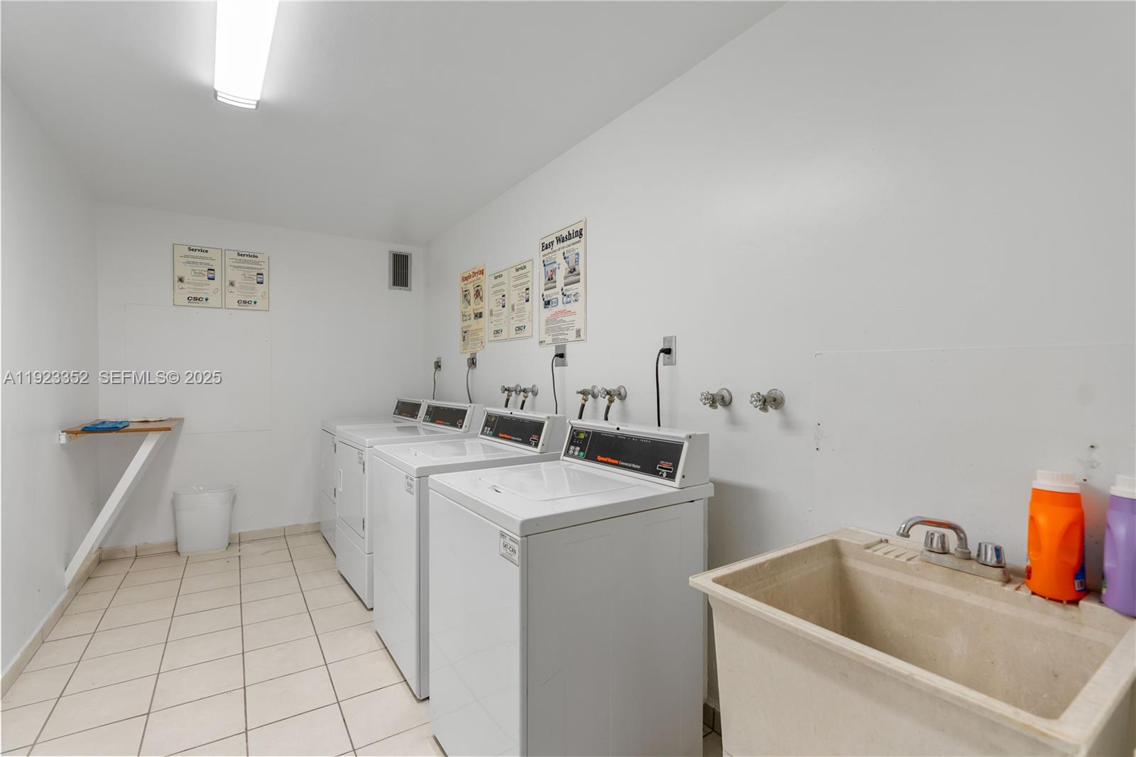 7135 Collins Avenue, Unit PH31 Miami Beach, FL 33141 - Photo 20 of 20 a utility room with dryer and washer