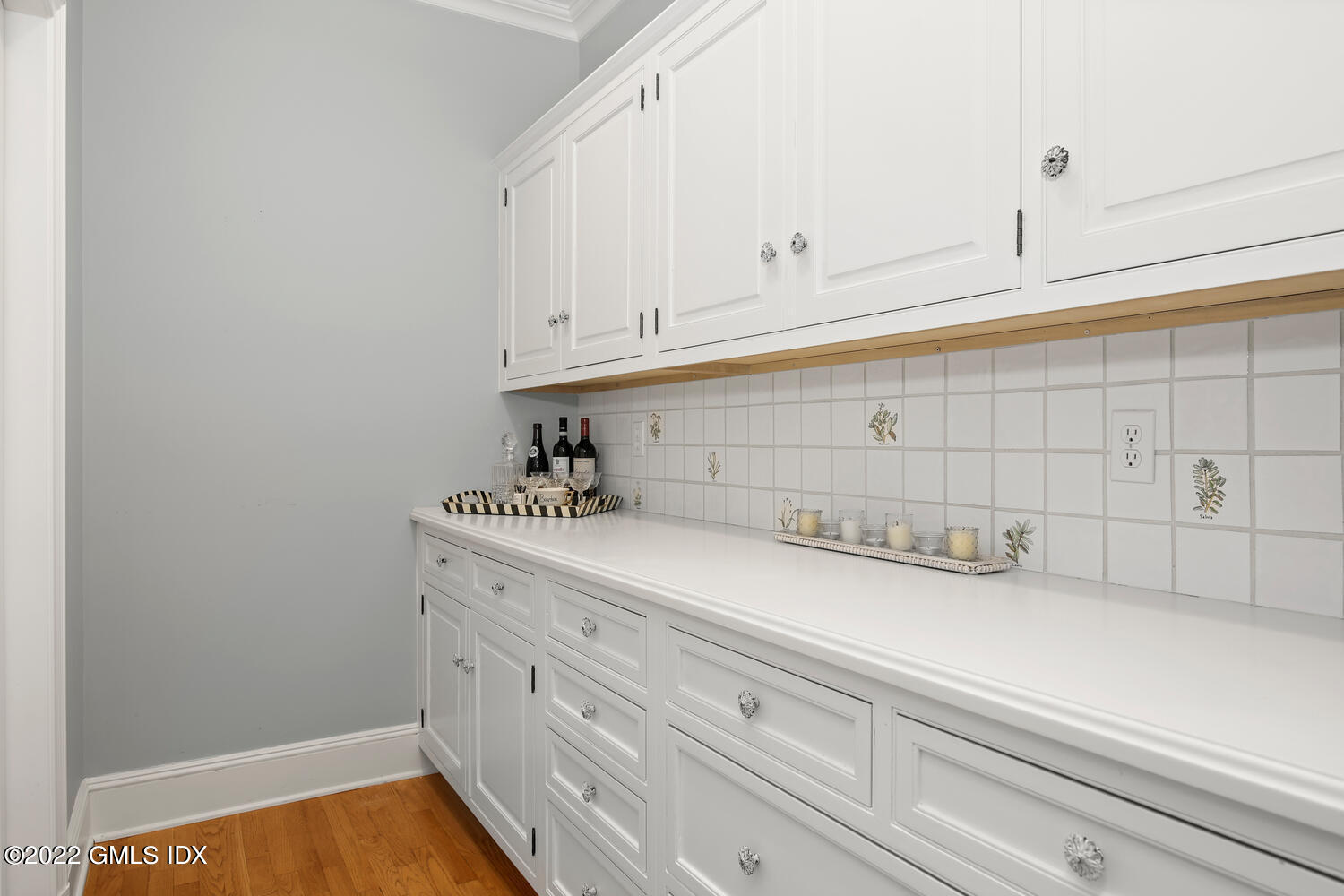 57 Partridge Hollow Road Greenwich, CT 06831 - Photo 18 of 102 a kitchen with white cabinets and a stove