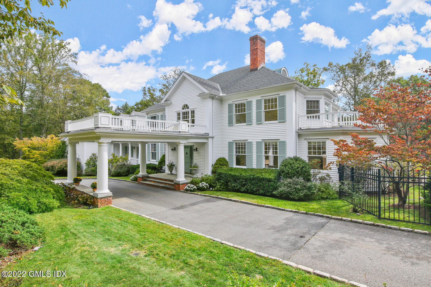 57 Partridge Hollow Road Greenwich, CT 06831 - Photo 2 of 102 a front view of a house with a yard