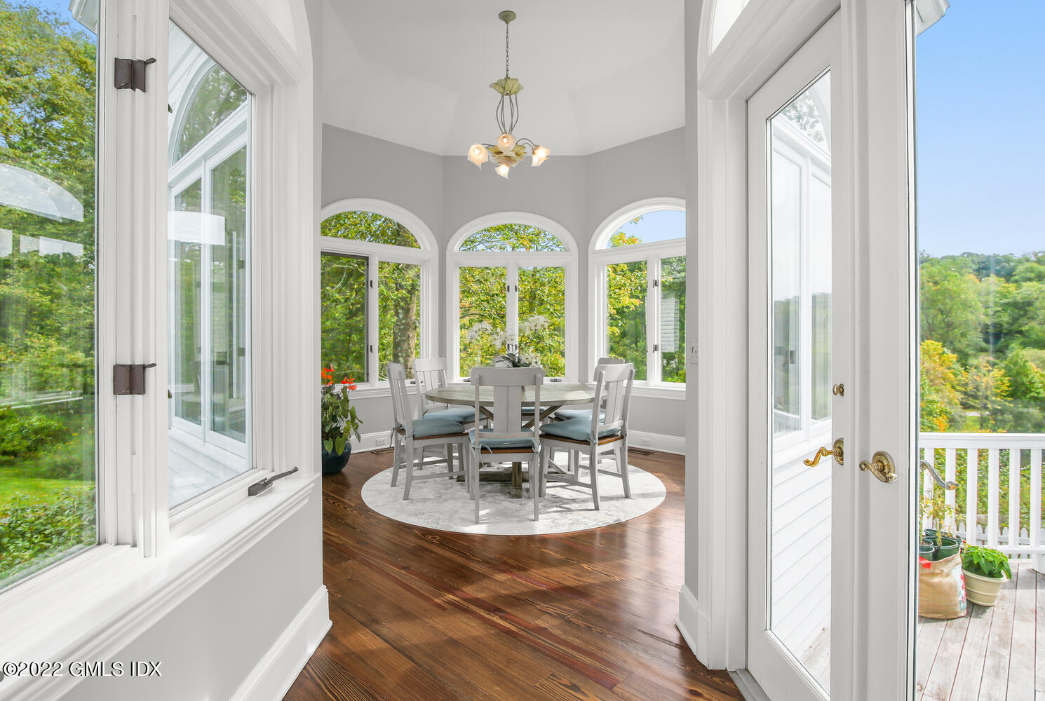 57 Partridge Hollow Road Greenwich, CT 06831 - Photo 31 of 102 a view of a dining room with furniture a chandelier and wooden floor