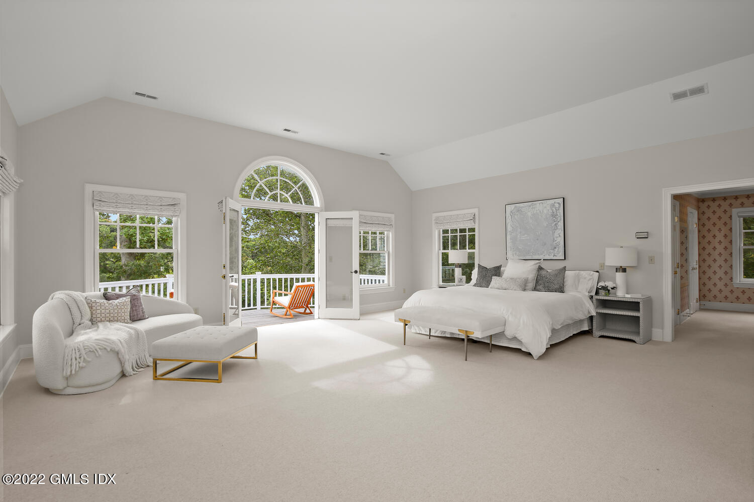 57 Partridge Hollow Road Greenwich, CT 06831 - Photo 36 of 102 a spacious bedroom with a bed and a large window