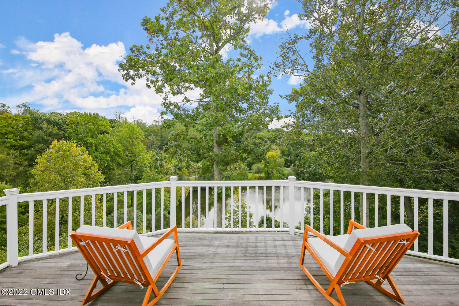 57 Partridge Hollow Road Greenwich, CT 06831 - Photo 38 of 102 a view of a chair and table on the deck