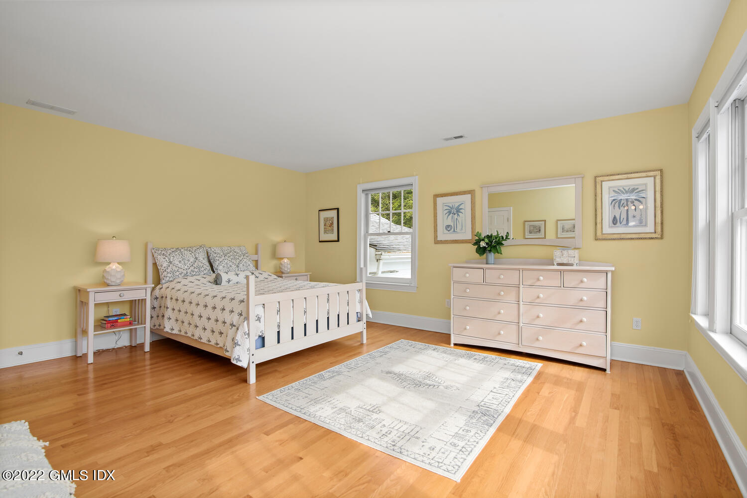 57 Partridge Hollow Road Greenwich, CT 06831 - Photo 48 of 102 a bedroom with a bed and wooden floor