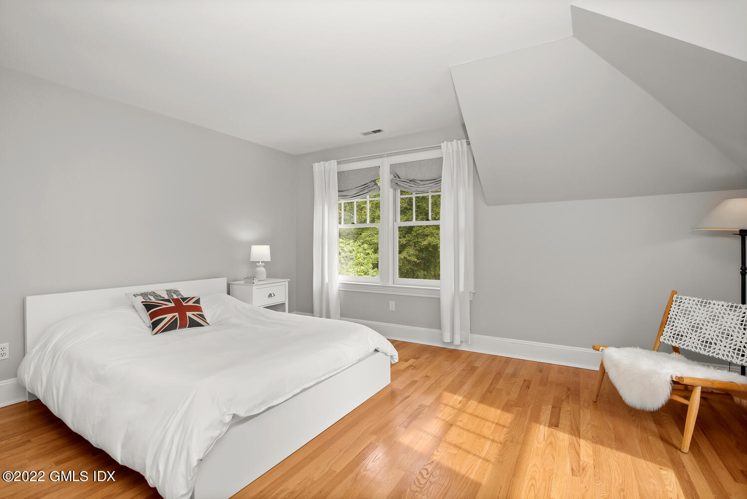 57 Partridge Hollow Road Greenwich, CT 06831 - Photo 51 of 102 a bedroom with a bed and window