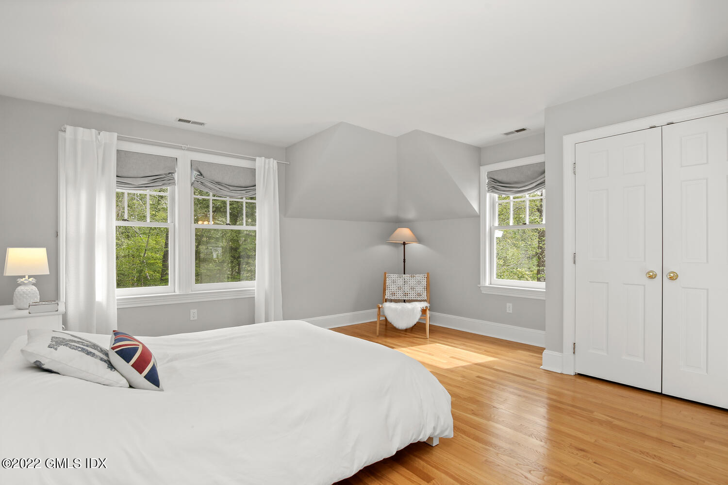57 Partridge Hollow Road Greenwich, CT 06831 - Photo 52 of 102 a bedroom with a bed and wooden floor