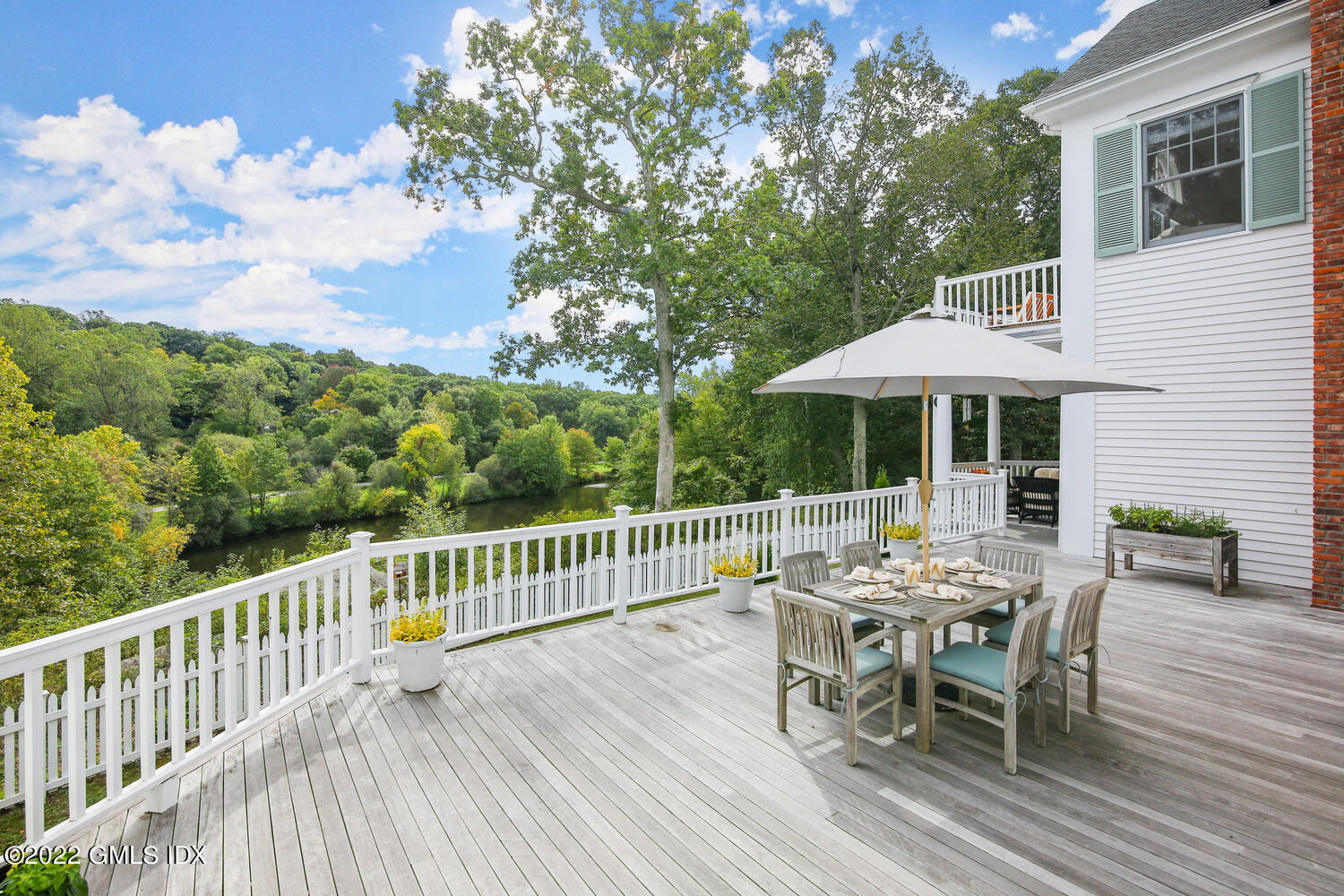 57 Partridge Hollow Road Greenwich, CT 06831 - Photo 58 of 102 a view of a table and chairs in patio of the house