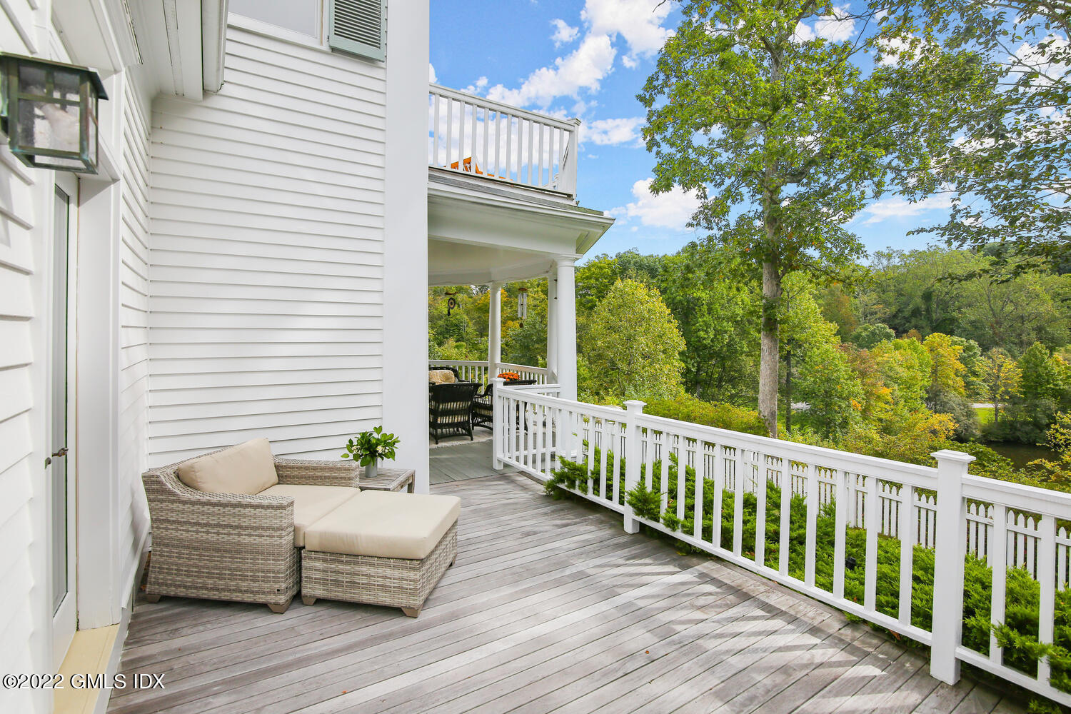57 Partridge Hollow Road Greenwich, CT 06831 - Photo 61 of 102 a balcony with furniture and wooden floor