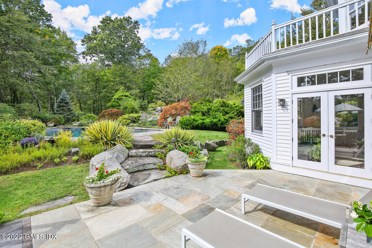57 Partridge Hollow Road Greenwich, CT 06831 - Photo 64 of 102 a front view of a house with garden