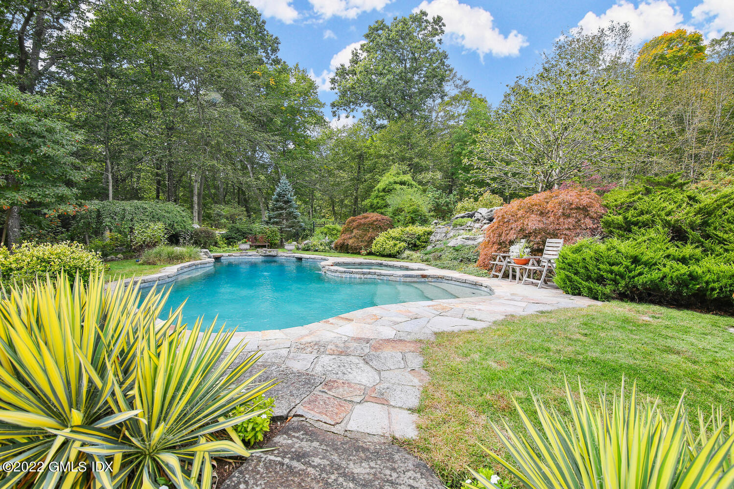 57 Partridge Hollow Road Greenwich, CT 06831 - Photo 66 of 102 a view of a swimming pool with a patio