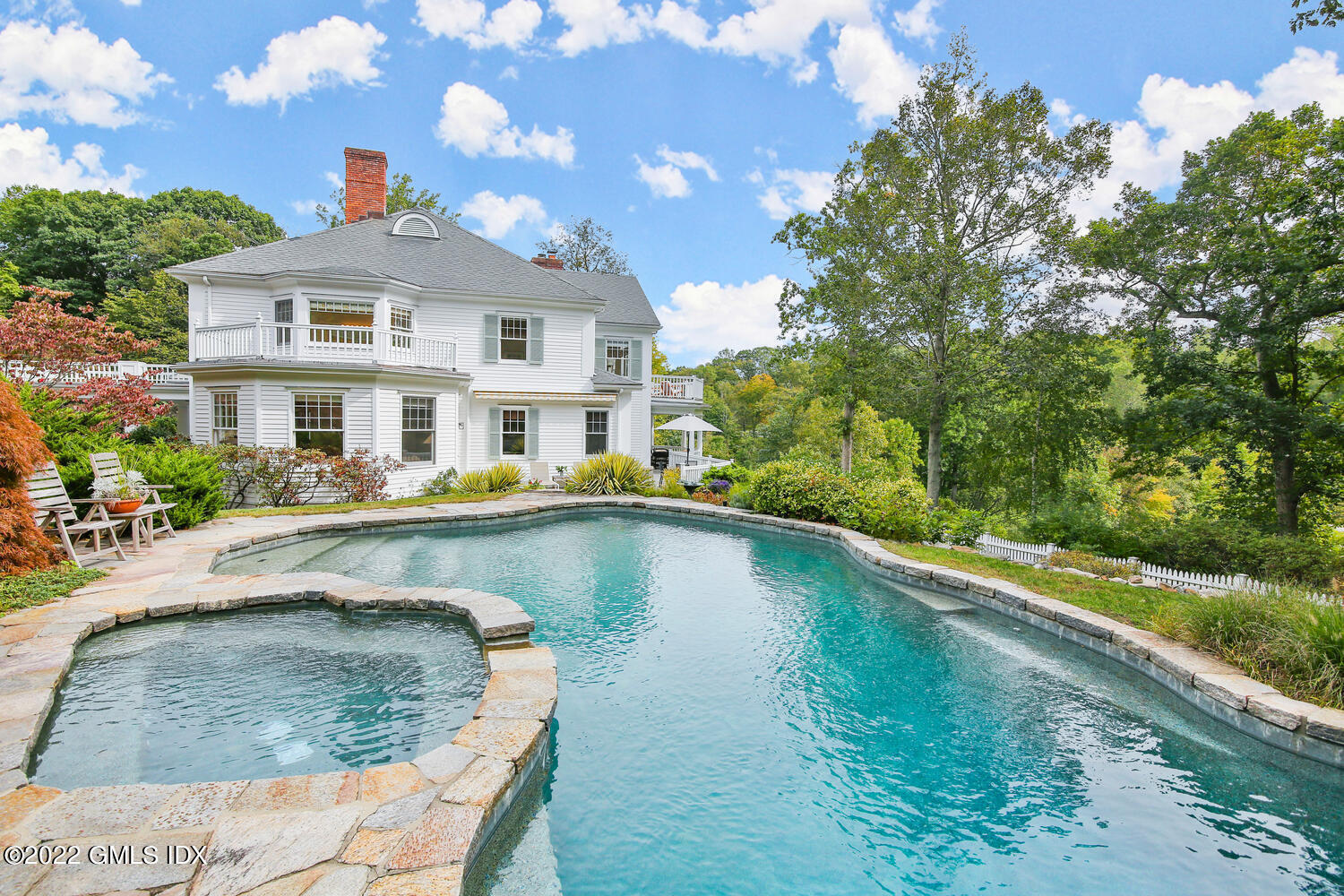 57 Partridge Hollow Road Greenwich, CT 06831 - Photo 67 of 102 a view of a house with swimming pool and sitting area