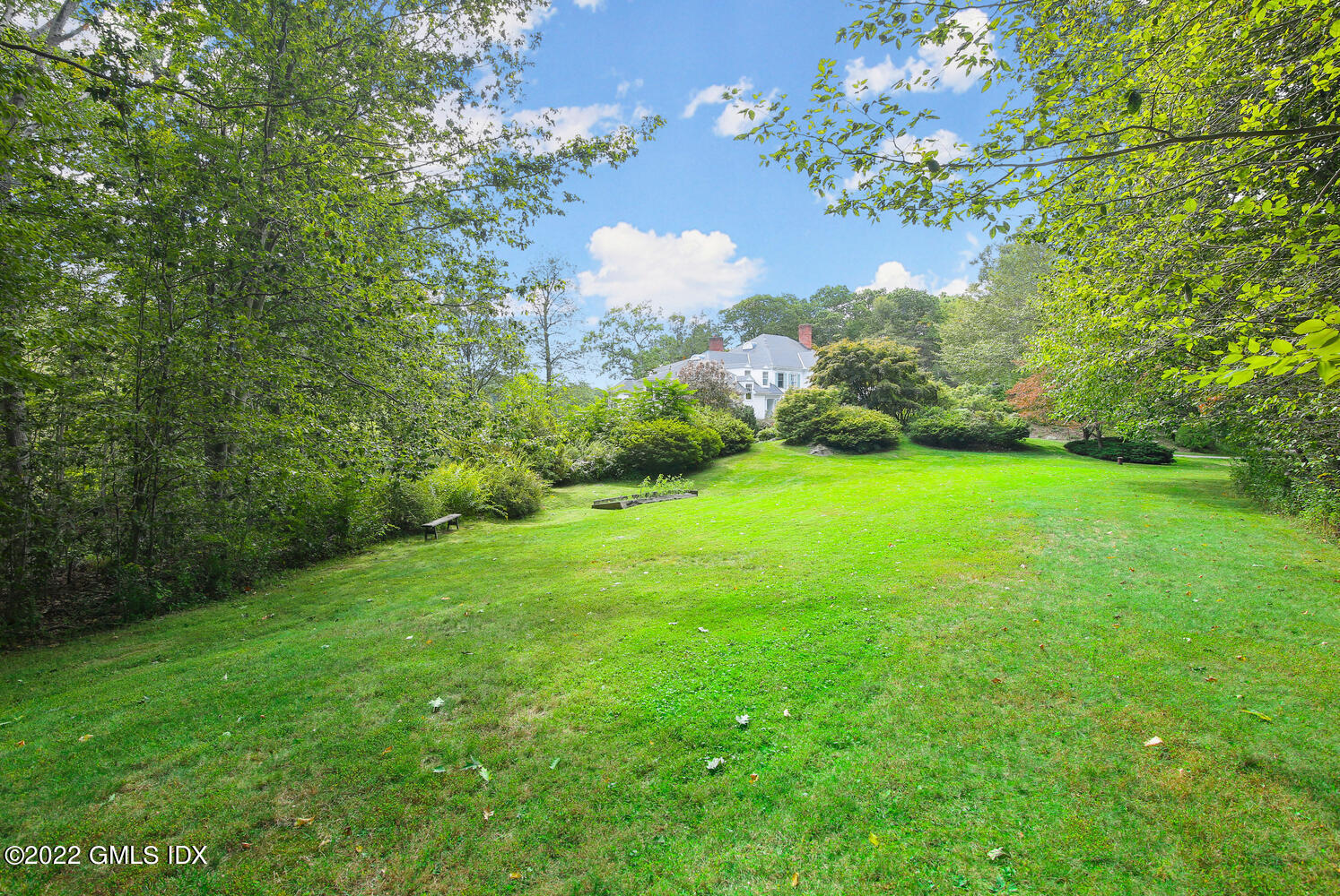 57 Partridge Hollow Road Greenwich, CT 06831 - Photo 72 of 102 a view of a grassy field with an tree