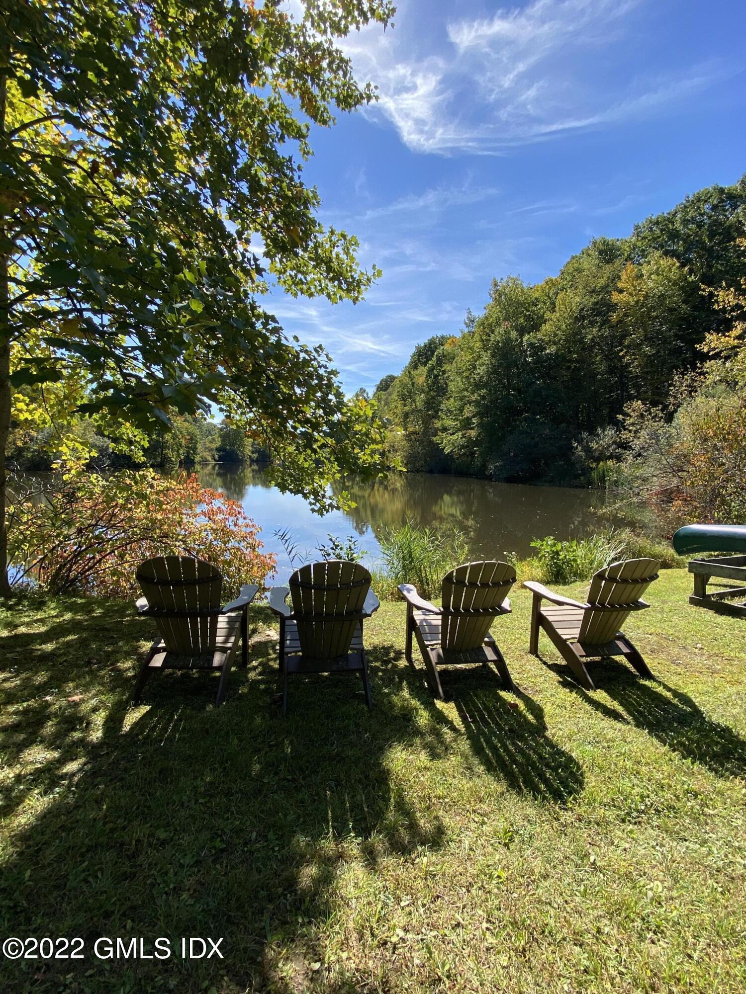57 Partridge Hollow Road Greenwich, CT 06831 - Photo 94 of 102 a view of a lake with outdoor space
