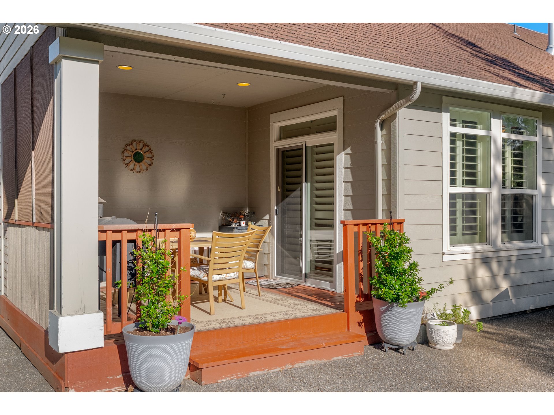 945 Northwest Angel Heights Road Stevenson, WA 98648 - Photo 9 of 41 a view of a patio with table and chairs potted plants