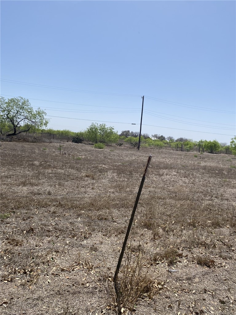 603 Southwest Sw 10th Street Premont, TX 78375 - Photo 3 of 4 a view of a dry yard with a lake