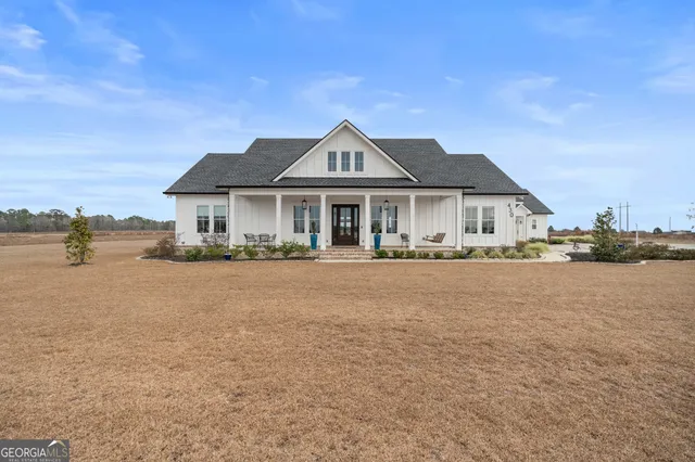 a front view of a house with a lake view
