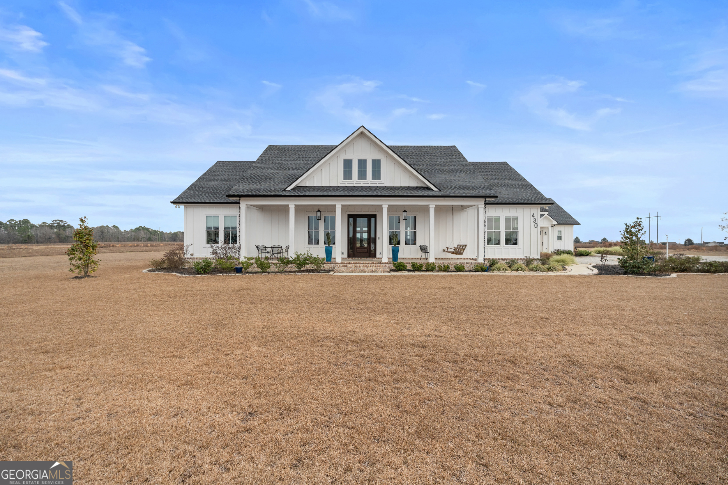 a front view of a house with a lake view