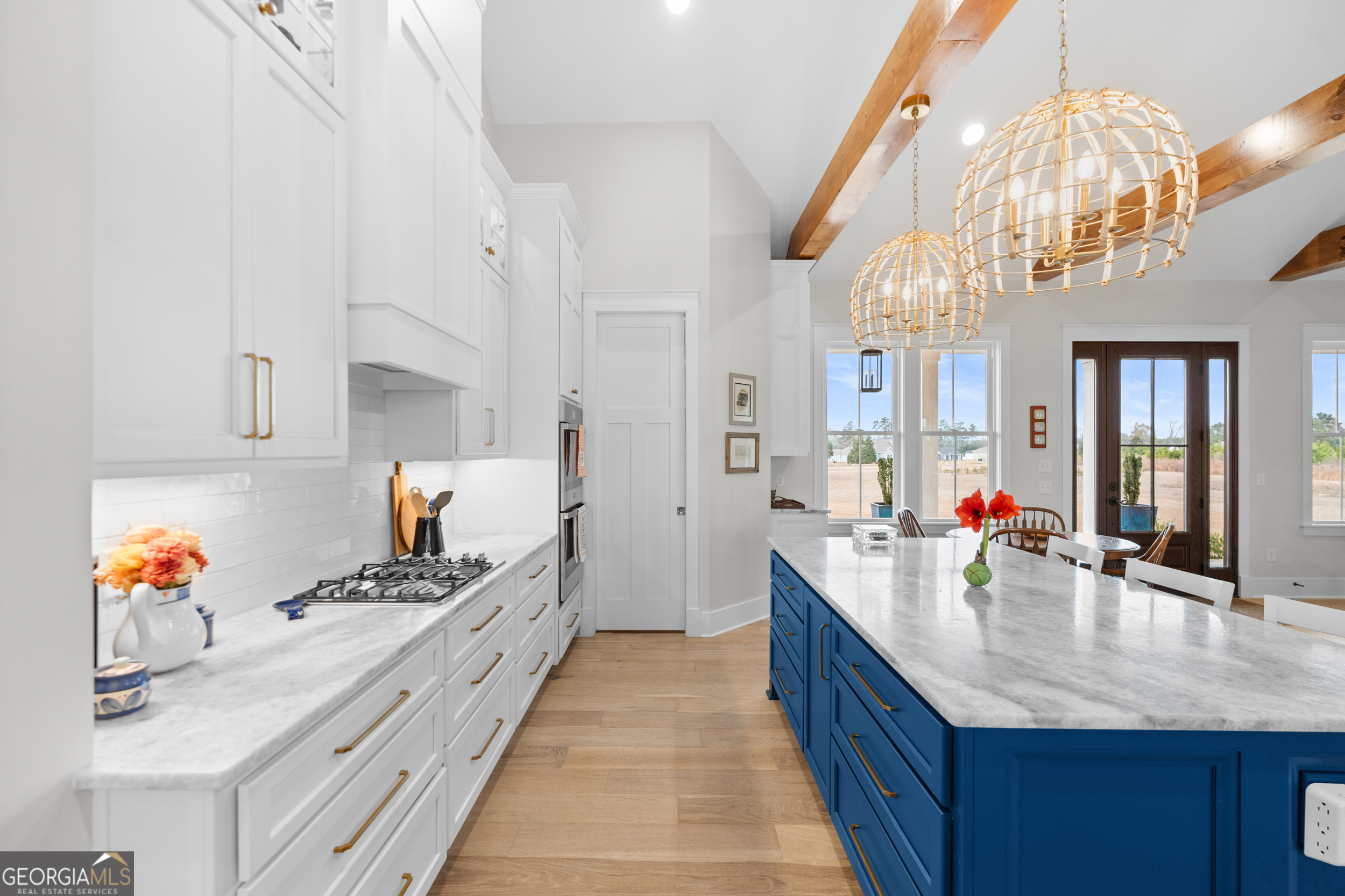 430 Jack Kennedy Road Statesboro, GA 30458 - Photo 11 of 44 a large kitchen with stainless steel appliances granite countertop a sink dishwasher and cabinets with wooden floor