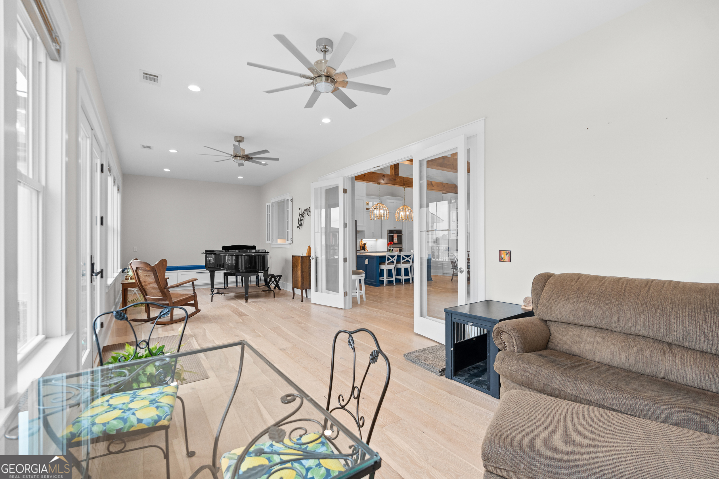 430 Jack Kennedy Road Statesboro, GA 30458 - Photo 12 of 44 a living room with furniture and a chandelier