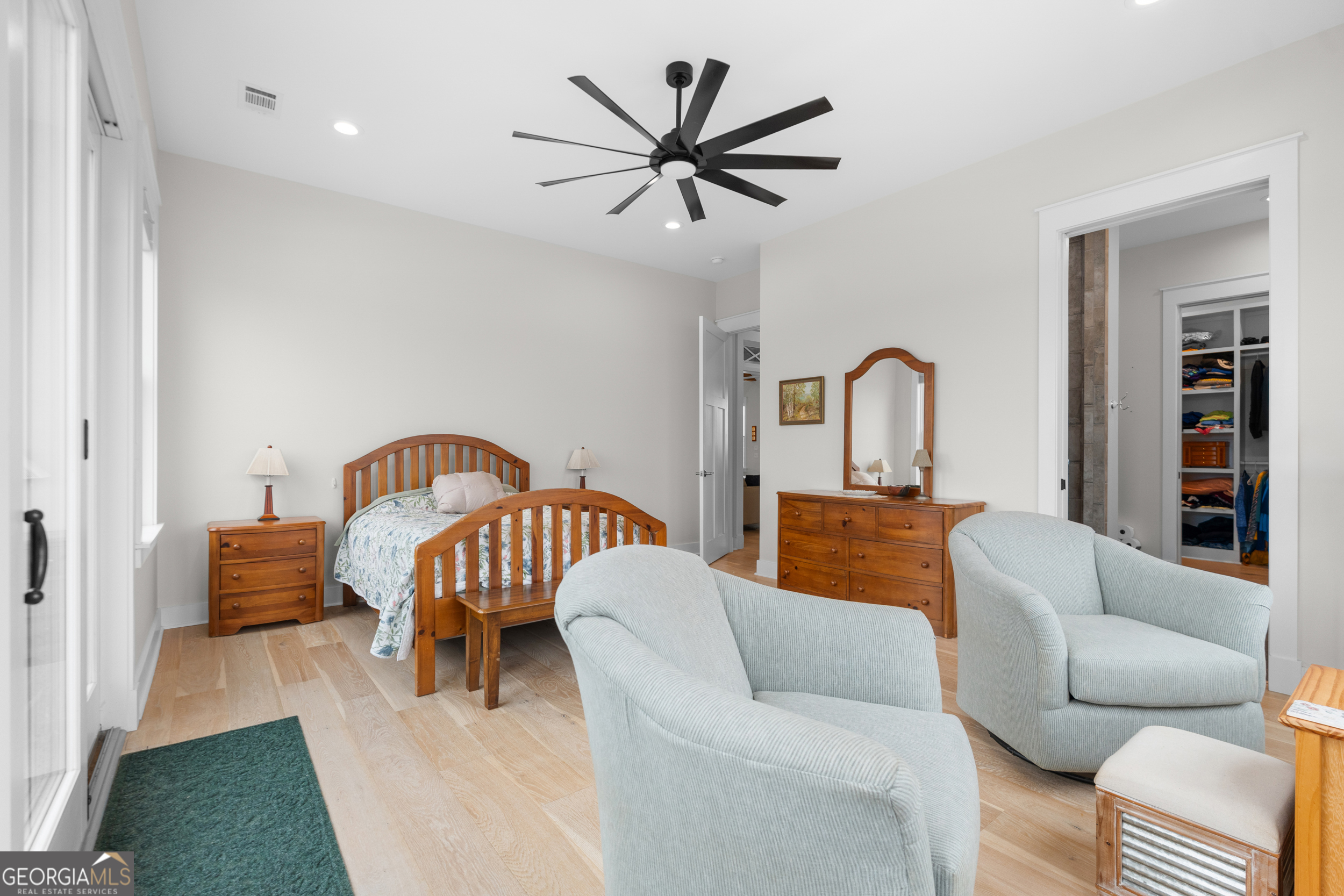 430 Jack Kennedy Road Statesboro, GA 30458 - Photo 15 of 44 a living room with furniture two windows and a ceiling fan