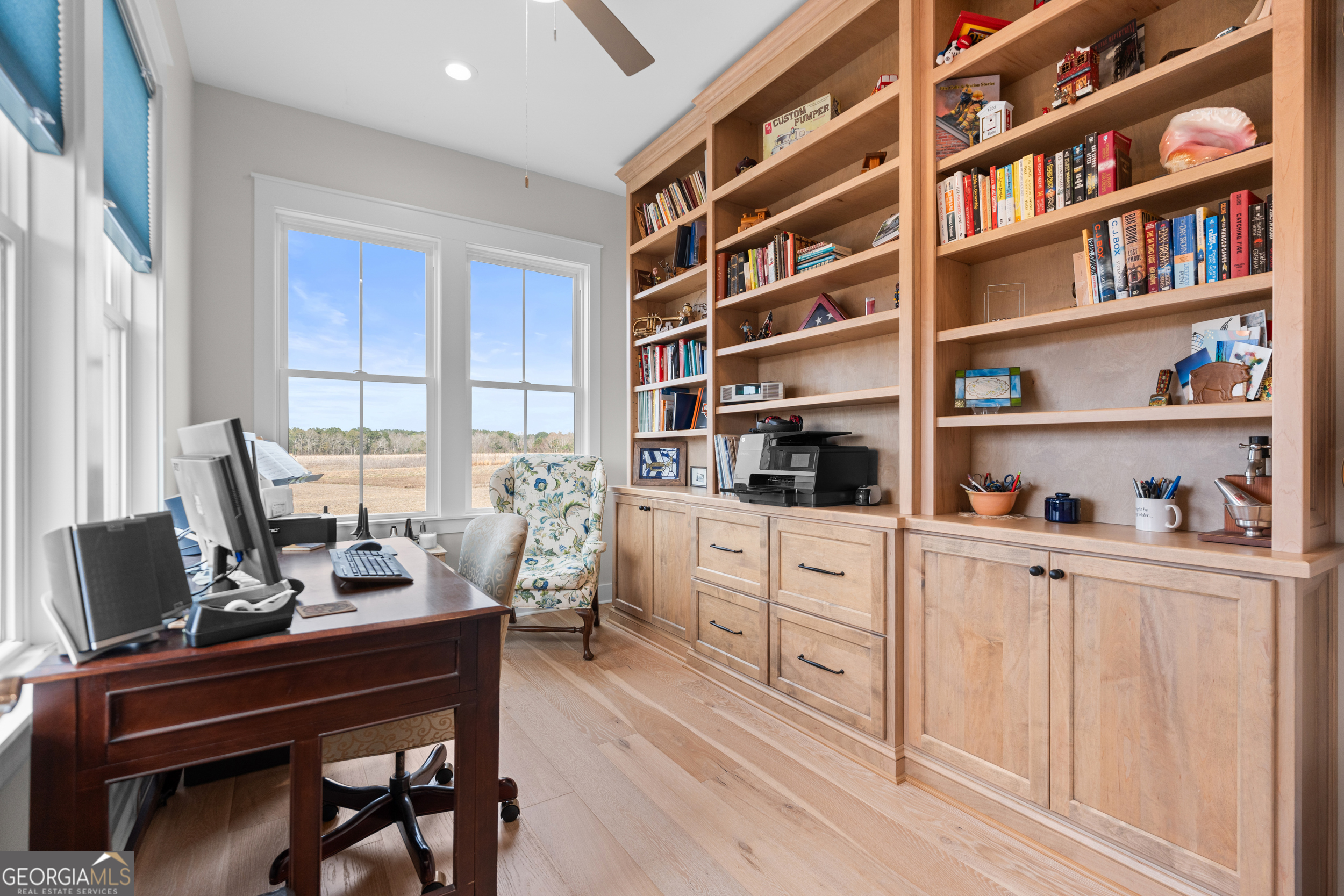 430 Jack Kennedy Road Statesboro, GA 30458 - Photo 18 of 44 a room with a workspace and a bookshelf