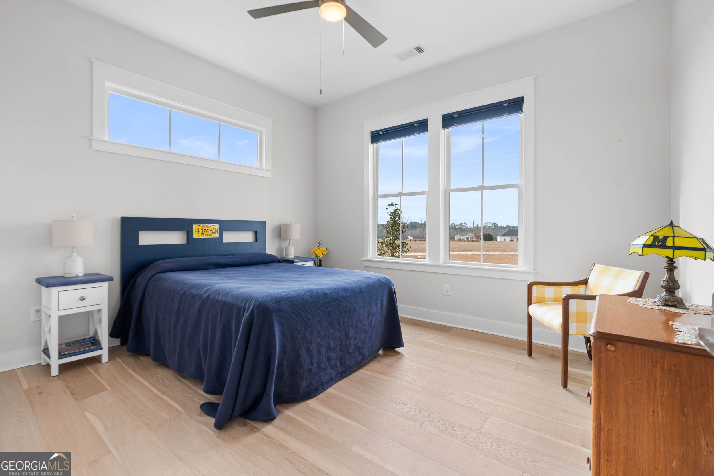 430 Jack Kennedy Road Statesboro, GA 30458 - Photo 19 of 44 a bedroom with a bed and a window