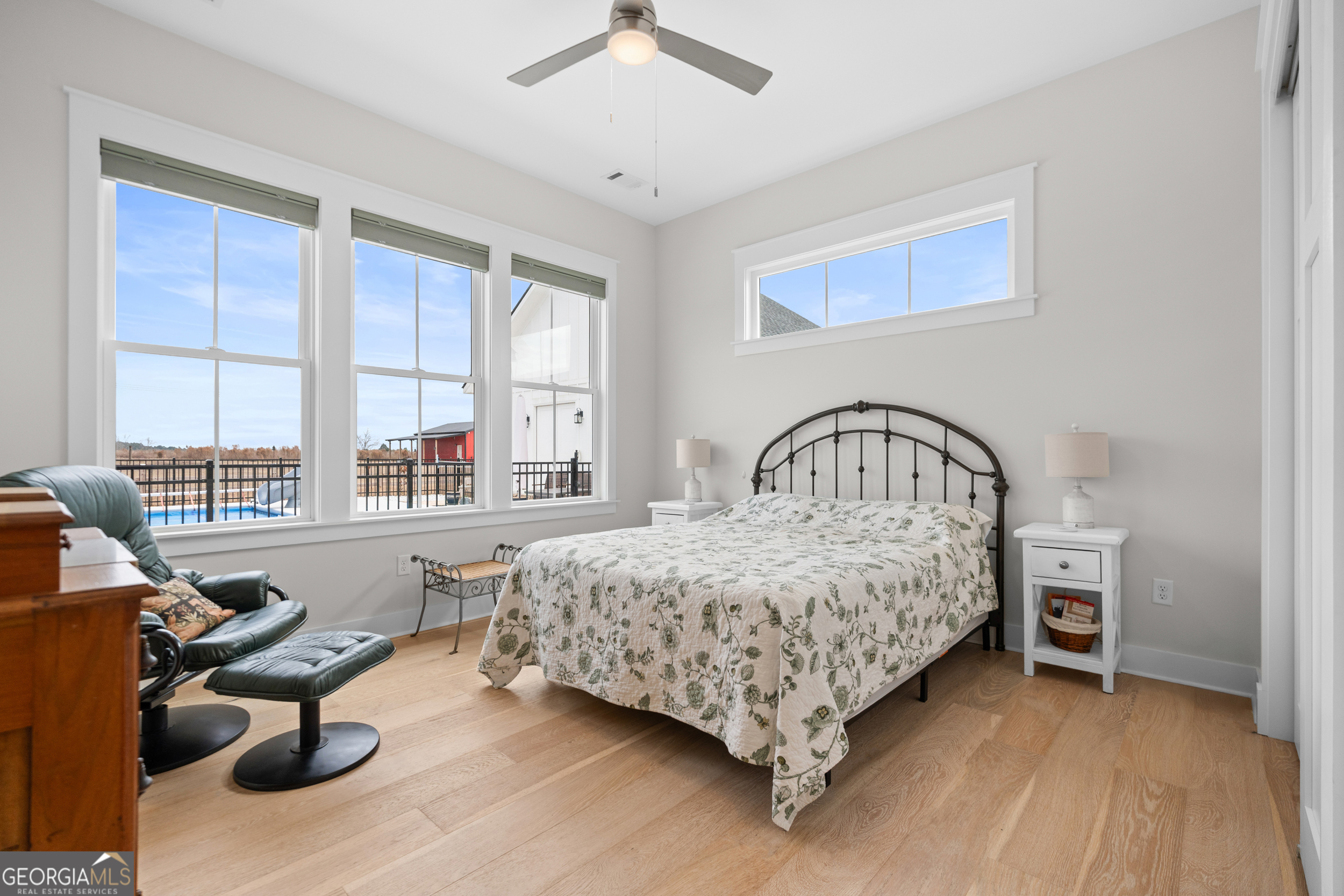 430 Jack Kennedy Road Statesboro, GA 30458 - Photo 22 of 44 a bedroom with bed and a large window