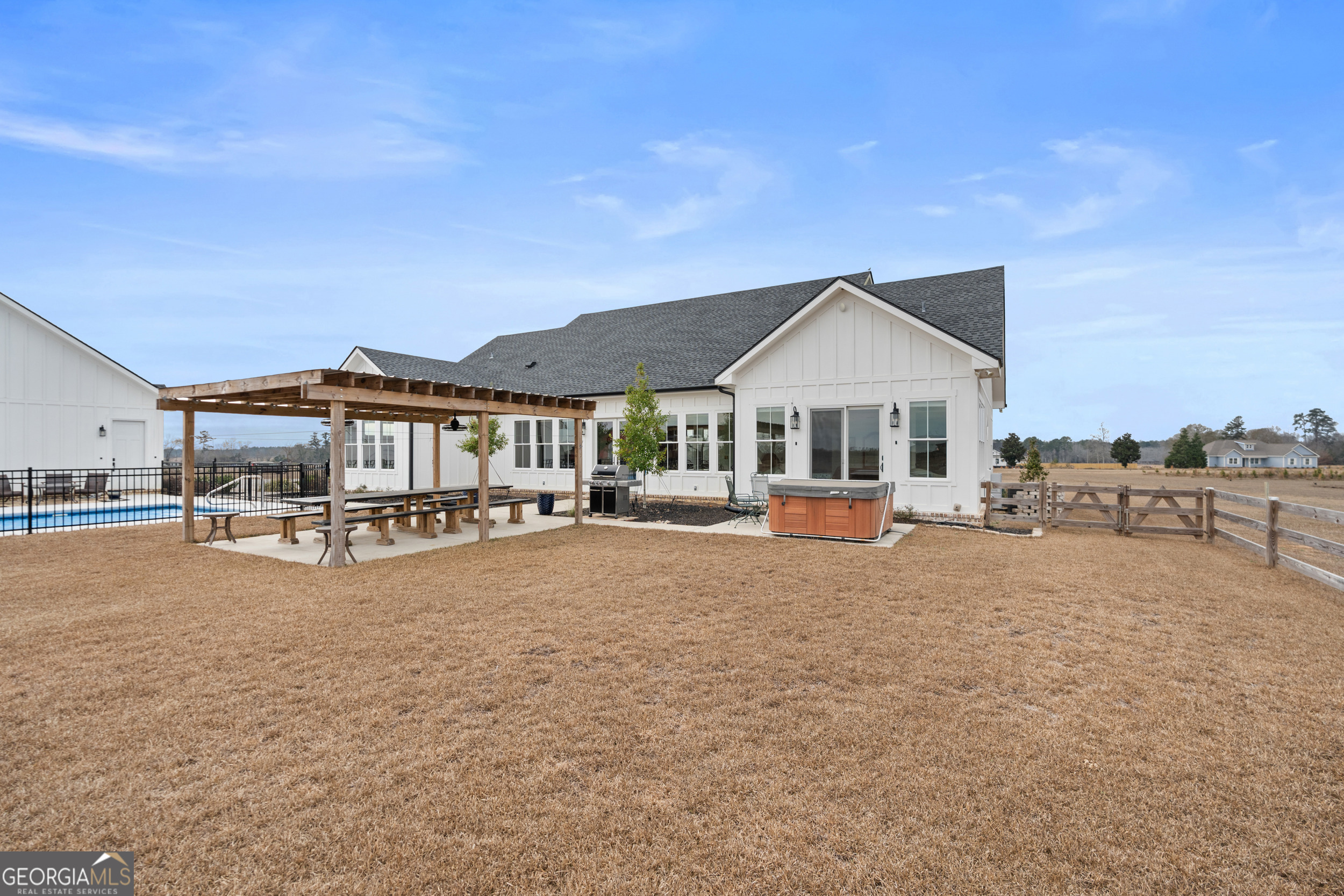 430 Jack Kennedy Road Statesboro, GA 30458 - Photo 25 of 44 a front view of a house with yard swimming pool and outdoor seating