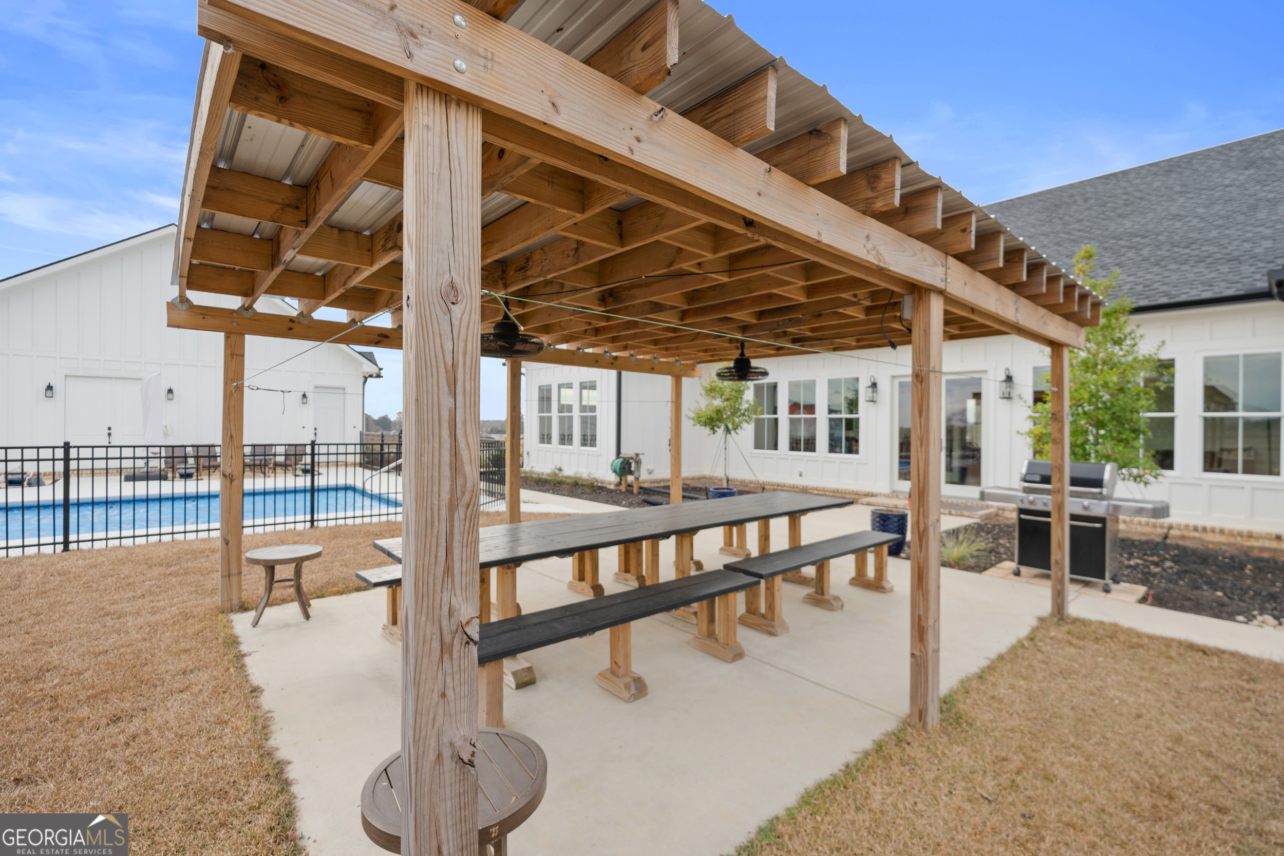 430 Jack Kennedy Road Statesboro, GA 30458 - Photo 26 of 44 a view of a swimming pool with a patio and a outdoor view