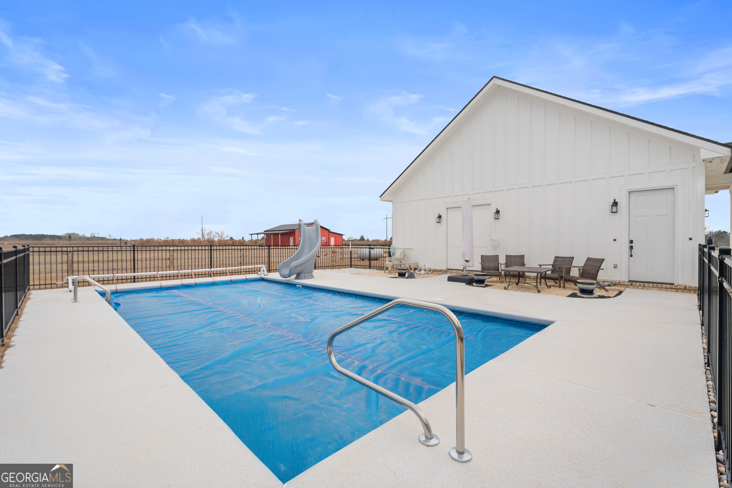 430 Jack Kennedy Road Statesboro, GA 30458 - Photo 27 of 44 a view of a kitchen with kitchen island and a wooden floor