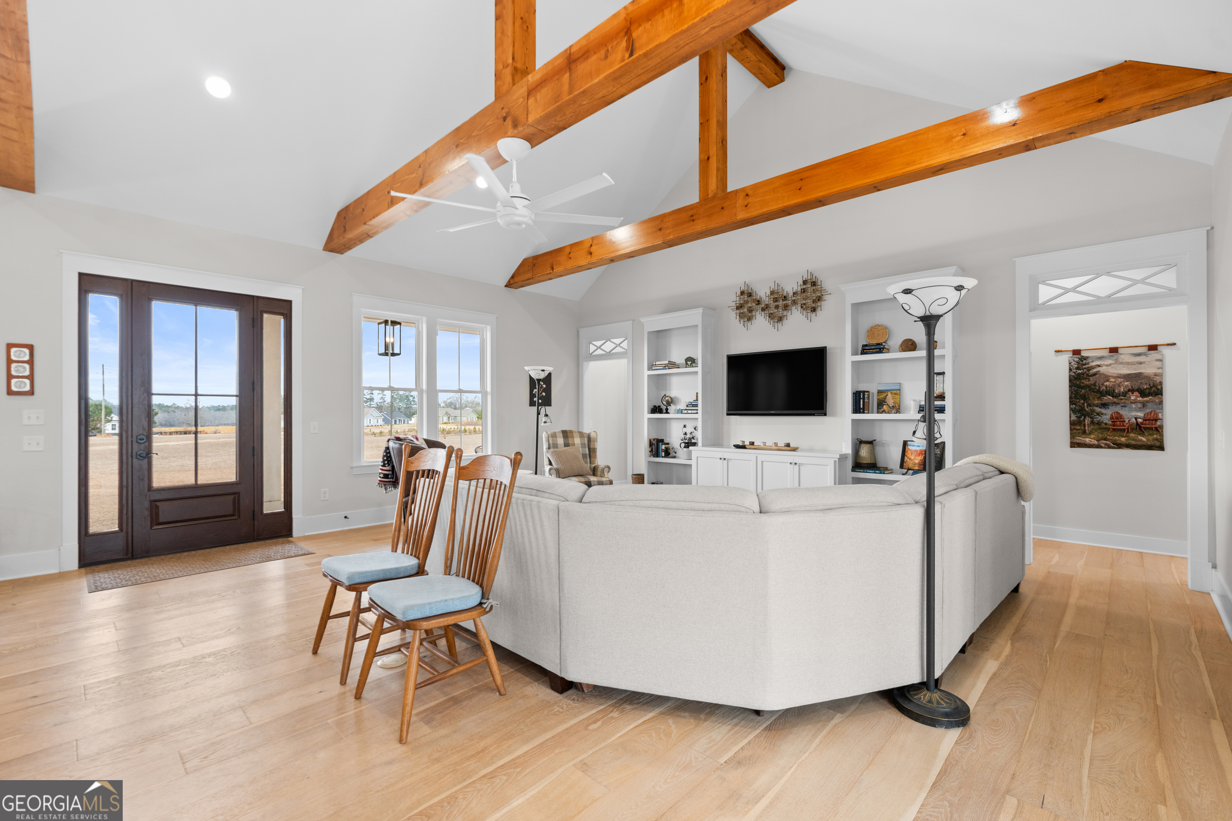 430 Jack Kennedy Road Statesboro, GA 30458 - Photo 7 of 44 a living room with furniture a flat screen tv and a refrigerator