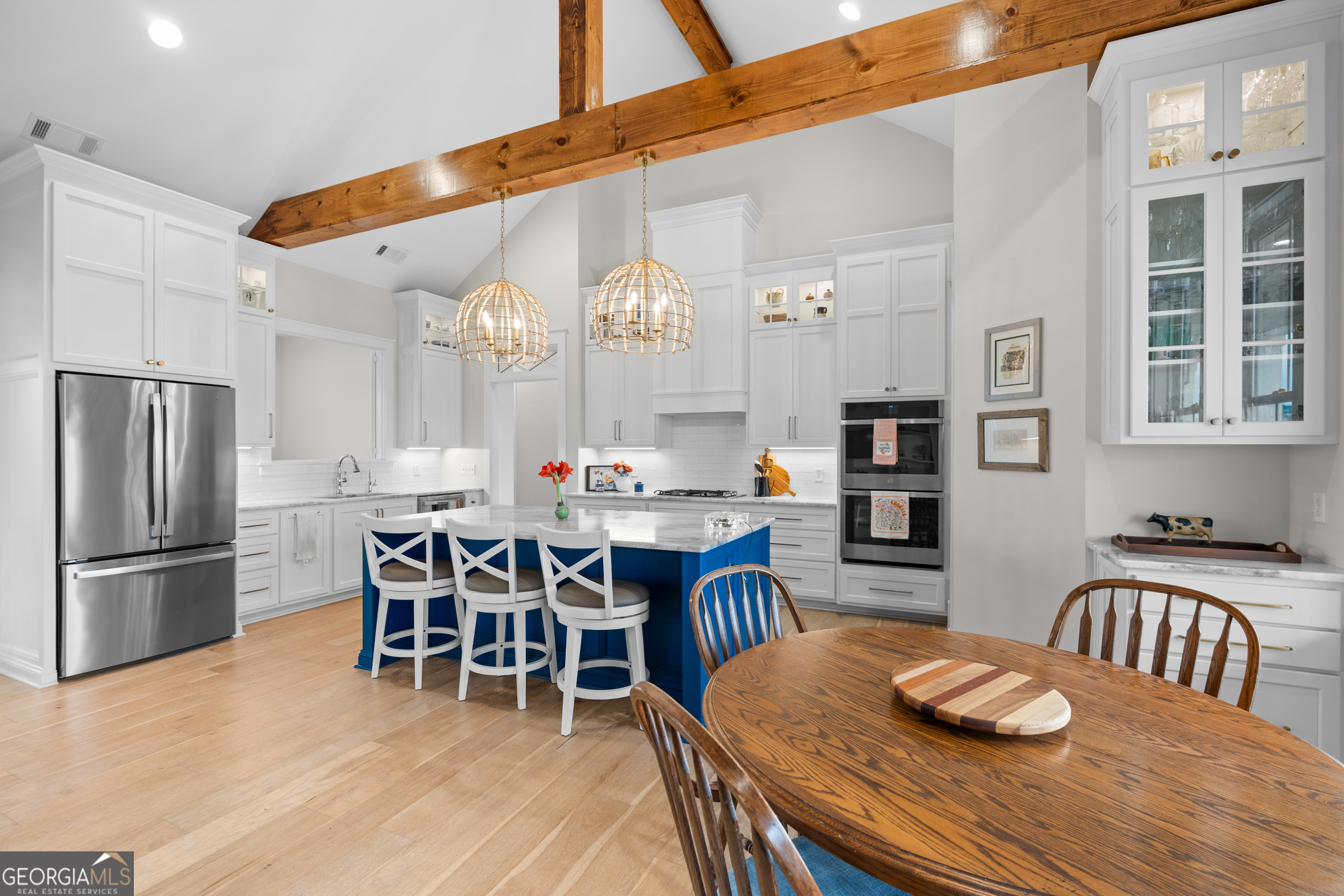 430 Jack Kennedy Road Statesboro, GA 30458 - Photo 9 of 44 a kitchen with stainless steel appliances granite countertop a dining table and chairs