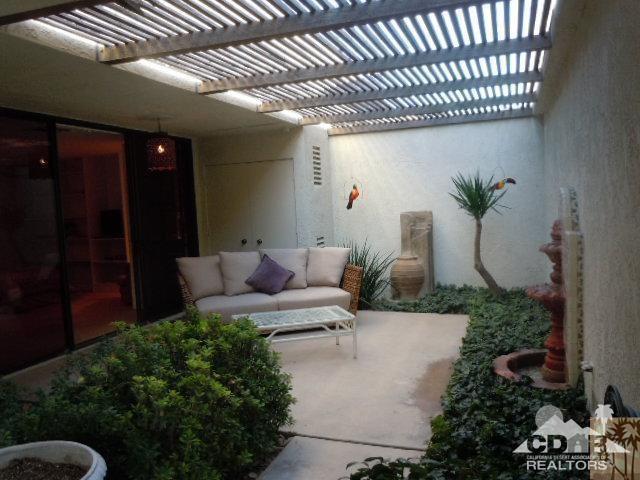 8 Duke Drive Rancho Mirage, CA 92270 - Photo 12 of 15 a view of a porch with furniture and a yard