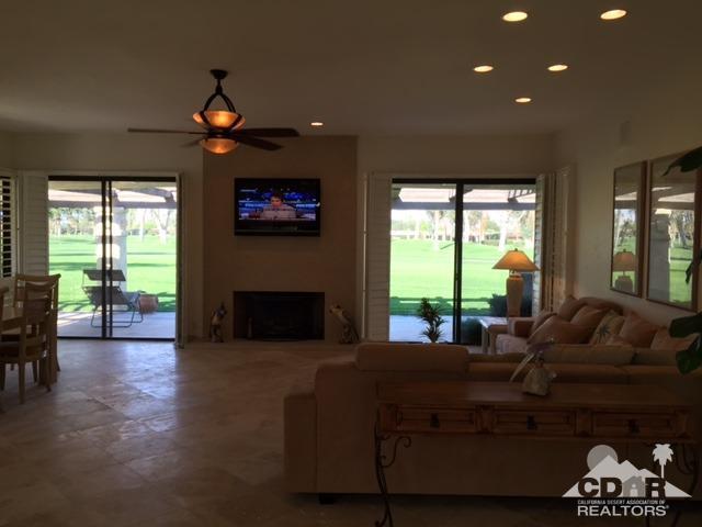 8 Duke Drive Rancho Mirage, CA 92270 - Photo 2 of 15 a living room with furniture and a large window