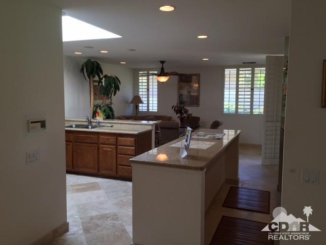 8 Duke Drive Rancho Mirage, CA 92270 - Photo 4 of 15 a kitchen with a sink stove and cabinets