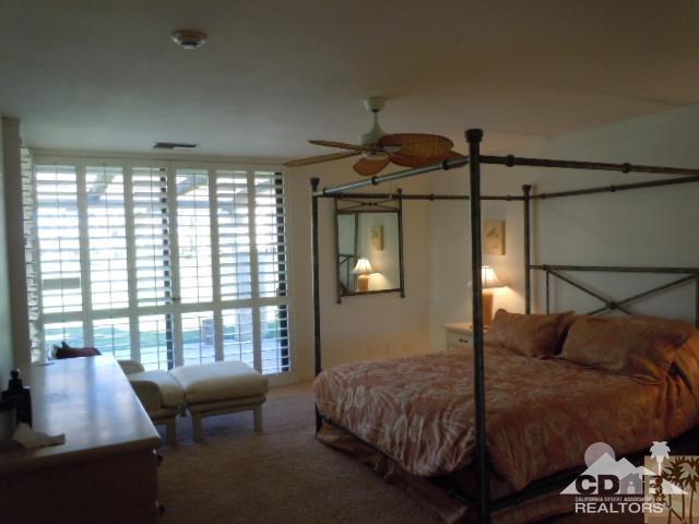 8 Duke Drive Rancho Mirage, CA 92270 - Photo 5 of 15 a bedroom with a bed and a window