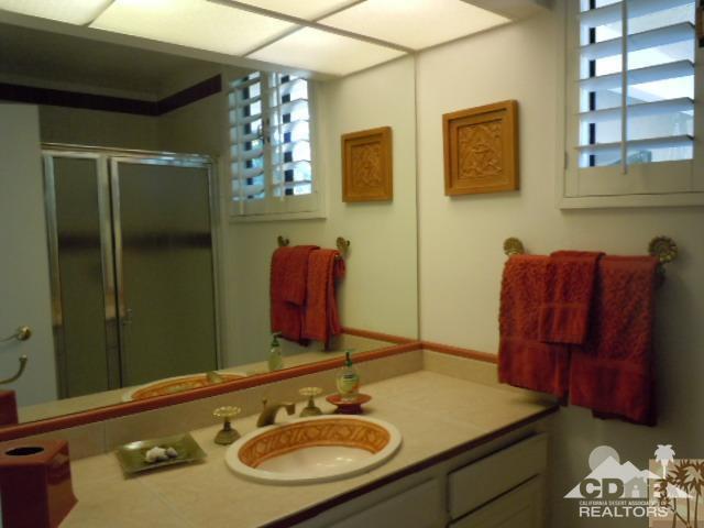 8 Duke Drive Rancho Mirage, CA 92270 - Photo 8 of 15 a bathroom with a sink and a mirror
