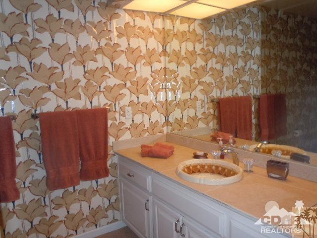 8 Duke Drive Rancho Mirage, CA 92270 - Photo 10 of 15 a bathroom with a sink and a mirror