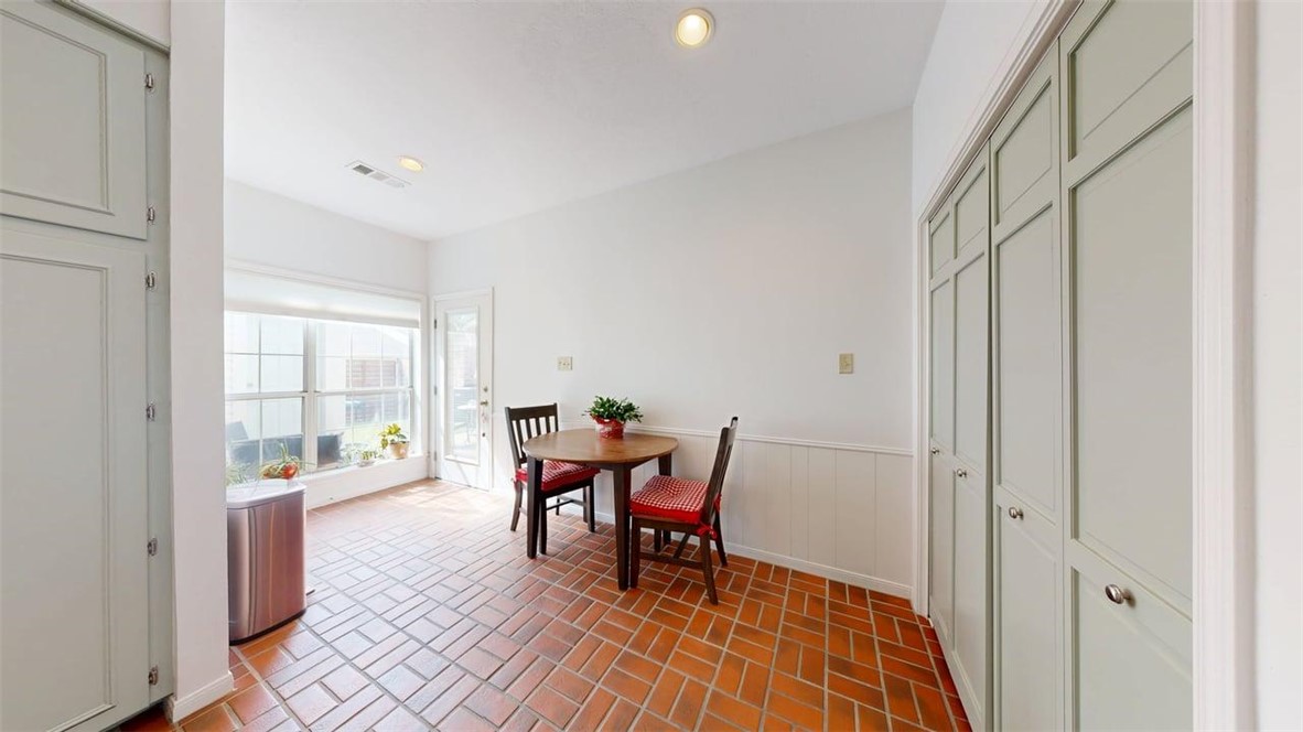 705 Walker Street Bryan, TX 77802 - Photo 15 of 46 a dining room with furniture and wooden floor