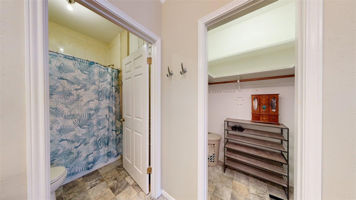 705 Walker Street Bryan, TX 77802 - Photo 27 of 46 a bathroom with a shower and a mirror