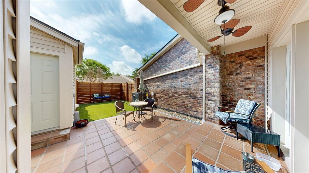 705 Walker Street Bryan, TX 77802 - Photo 30 of 46 a view of a patio with a table and chairs