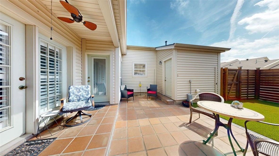 705 Walker Street Bryan, TX 77802 - Photo 34 of 46 a view of a patio with a table and chairs and potted plants