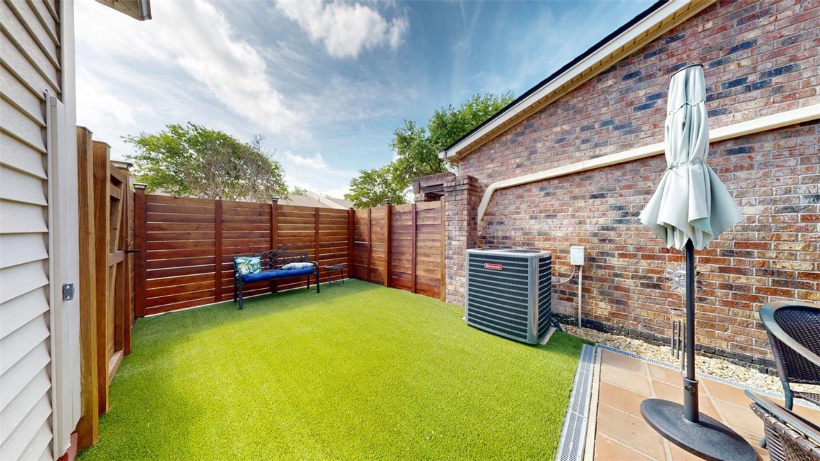 705 Walker Street Bryan, TX 77802 - Photo 39 of 46 a view of a backyard with chairs and a small yard