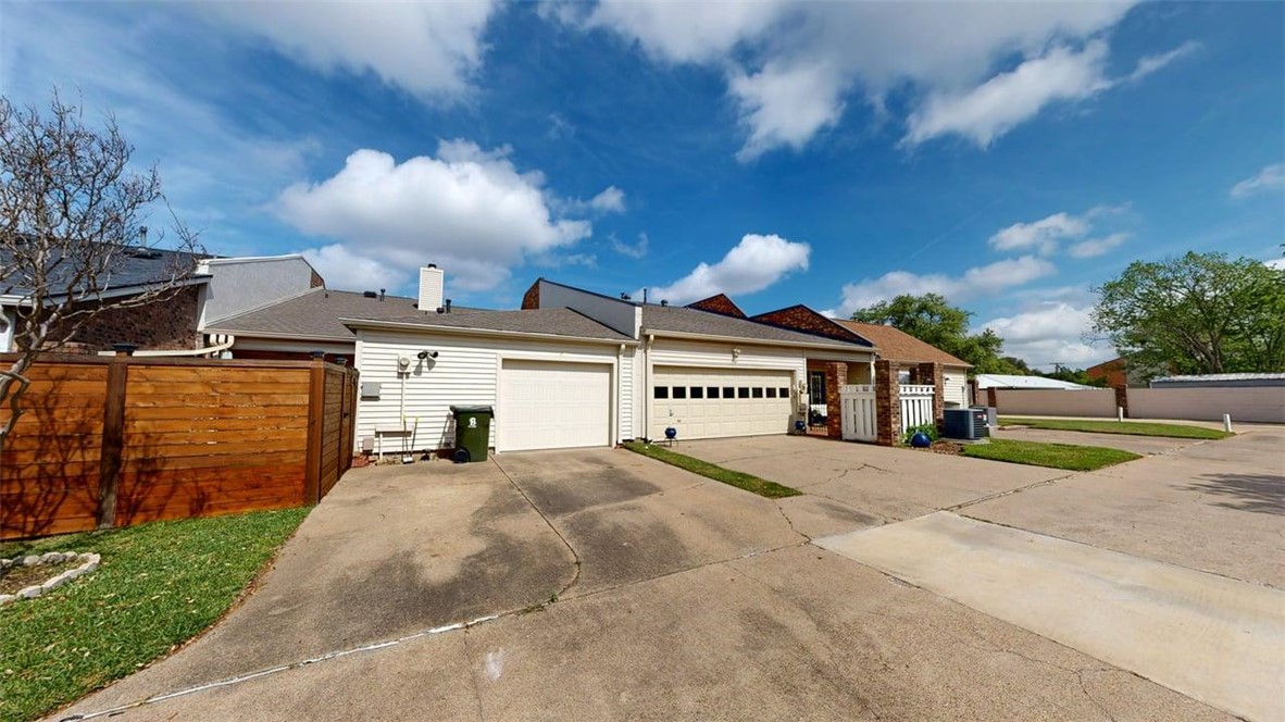 705 Walker Street Bryan, TX 77802 - Photo 43 of 46 a view of a house with a yard and garage