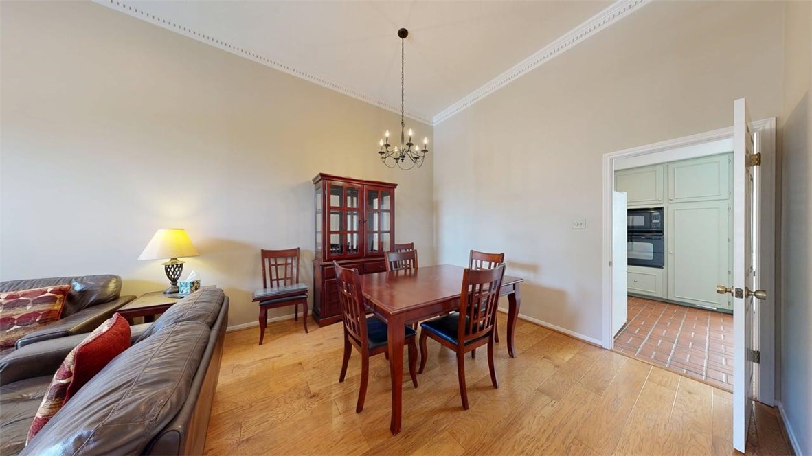 705 Walker Street Bryan, TX 77802 - Photo 5 of 46 a view of a dining room with furniture and wooden floor