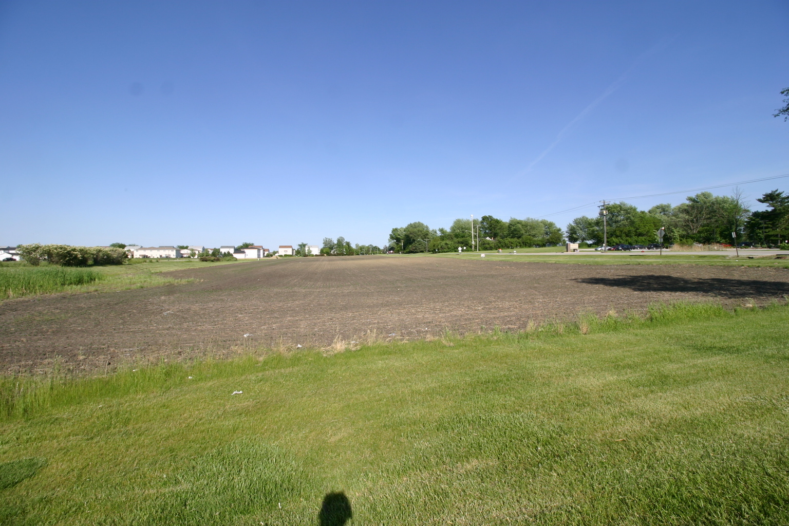 a view of a lake with houses in the back
